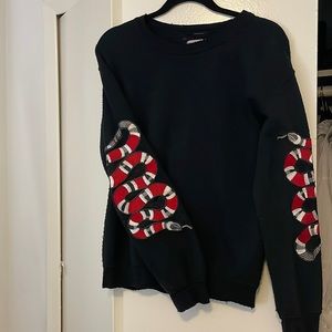 Planet blue black sweater with snake arm detailing